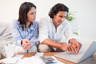 Couple checking their bank accounts online
