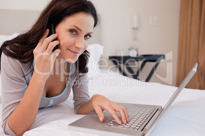 Woman on the phone surfing the internet