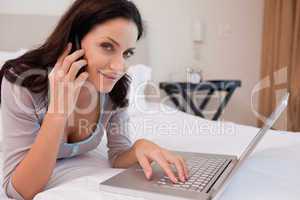 Woman on the phone surfing the internet