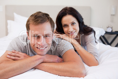 Couple relaxing on the bed together