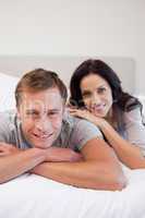 Young couple relaxing on the bed together