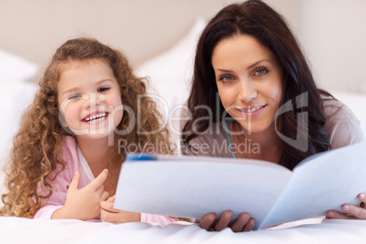 Mother and daughter enjoying reading together