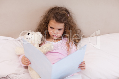 Girl looking at a book