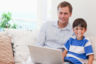 Father and son playing computer games together