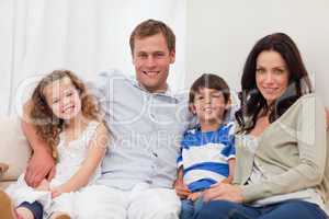 Family sitting on the sofa together