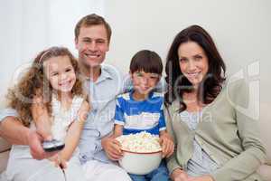 Family watching a movie together