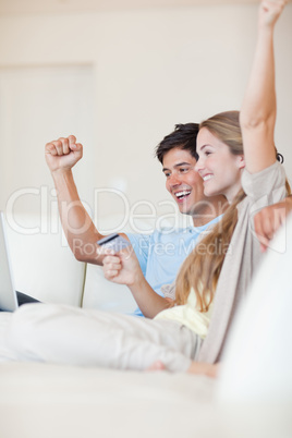 Portrait of a successful couple shopping online