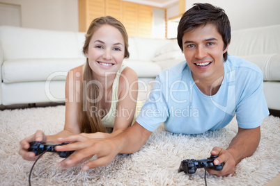 Young couple playing video games