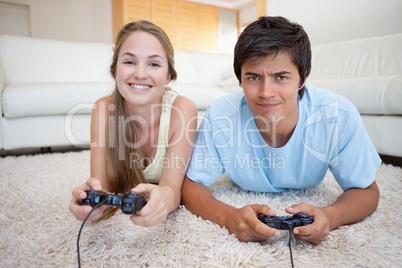 Cheerful couple playing video games