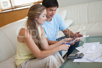 Couple cutting their credit card
