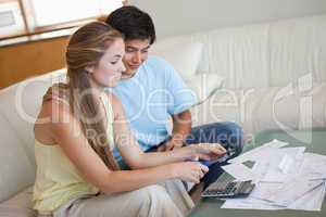 Young couple cutting their credit card