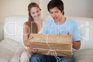 Young couple looking at a package