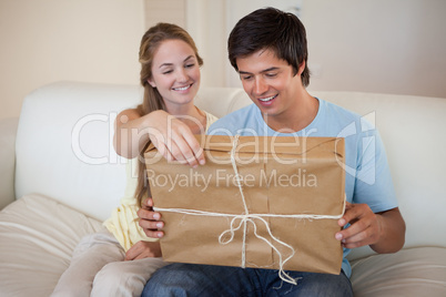 Couple opening a package