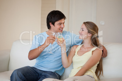 Couple drinking a glass of sparkling wine