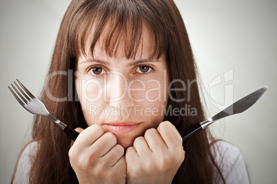 Women hand holding fork and knife