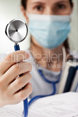 Doctor holding stethoscope