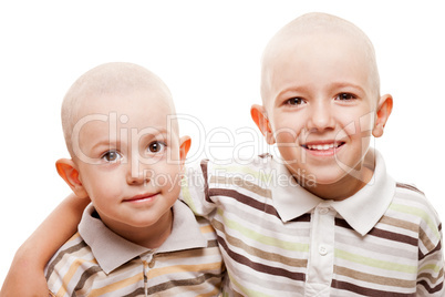 Shaved heads children smiling