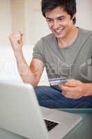 Portrait of a cheerful man shopping online