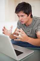 Portrait of an angry man during a video conference