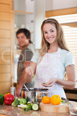 Portrait of a smiling couple cooking