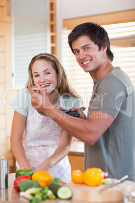 Portrait of a smiling couple preparing dinner