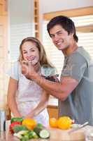 Portrait of a smiling couple preparing dinner