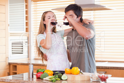 Lovely couple drinking red wine