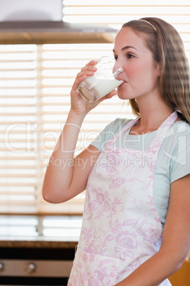 Portrait of a gorgeous woman drinking milk