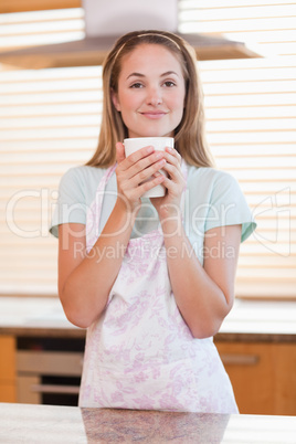 Portrait of a woman drinking a cup of tea