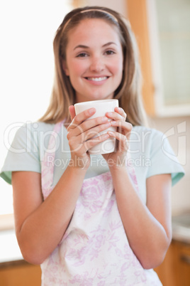 Portrait of a woman drinking a cup of coffee