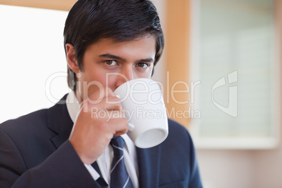 Close up of a businessman drinking coffee