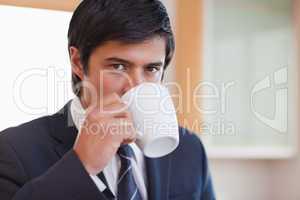 Close up of a businessman drinking coffee