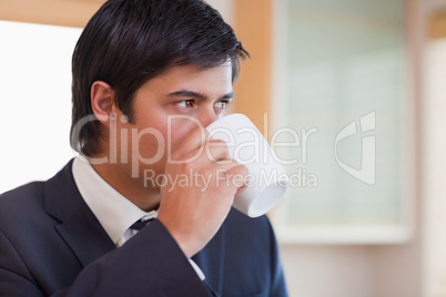 Close up of a businessman drinking tea