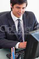 Portrait of a young businessman working with a computer