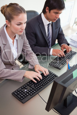 Portrait of business people working with computers