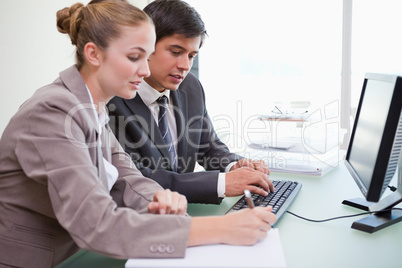 Young business people working with a computer