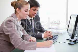 Young business people working with a computer