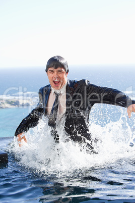 Portrait of a businessman going out of the water