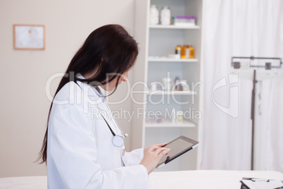 Doctor using a tablet computer