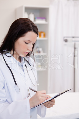 Female doctor taking notes