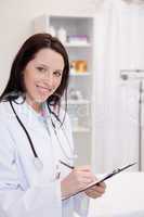 Smiling female doctor taking notes