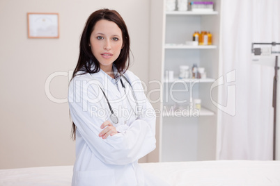 Female doctor with arms folded
