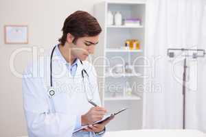 Male doctor with clipboard