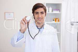 Male doctor using stethoscope