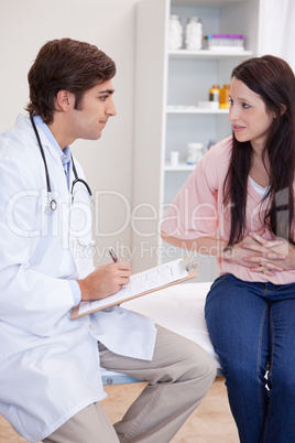 Male doctor talking with patient