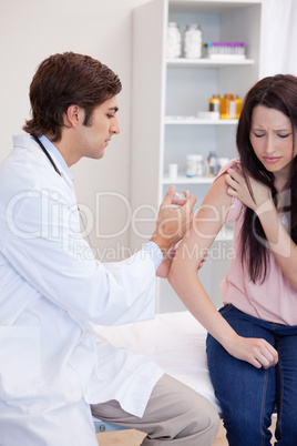 Patient getting an injection by male doctor