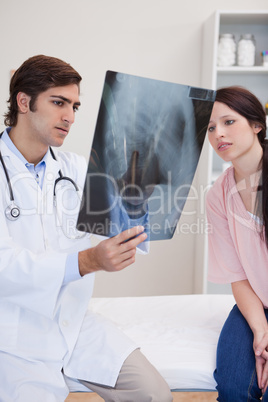 Doctor and patient looking at x-ray together