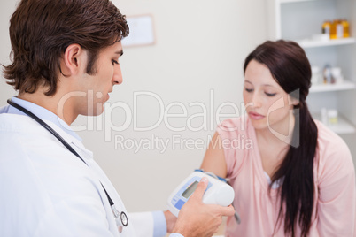 Patient having her blood pressure checked