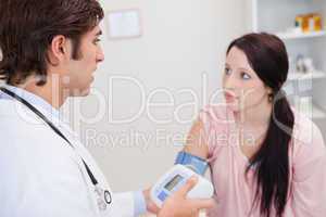 Woman getting her blood pressure checked