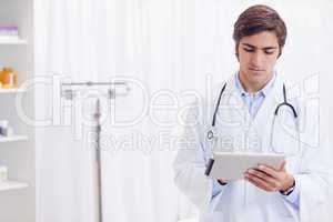 Doctor working on tablet